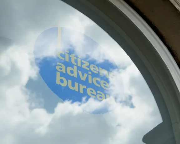 CAB logo in window with clouds